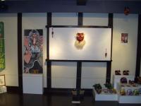 Back wall showing tengu mask bought in Okayama and, on the right, Minna's masks; note tengu geta (wooden clogs) on floor