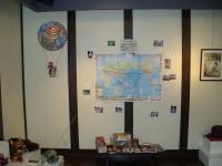 World trip tengus display - map of two tengus travel routes, and their giftsm photos, and diaries on the table below