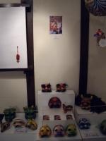 Minna mask corner with photo of Minna at work